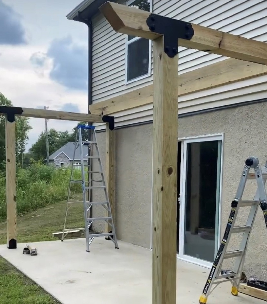 Pergola with the first rafter on