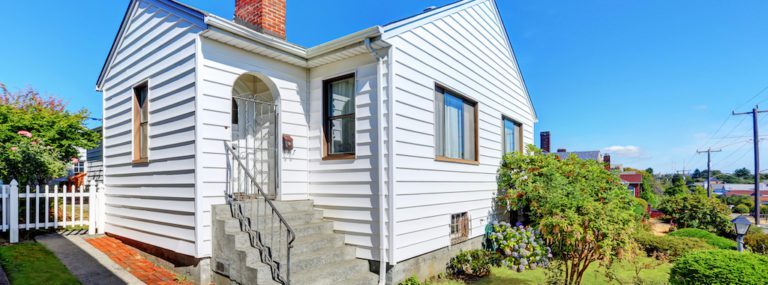 Cute small American house with white exterior paint