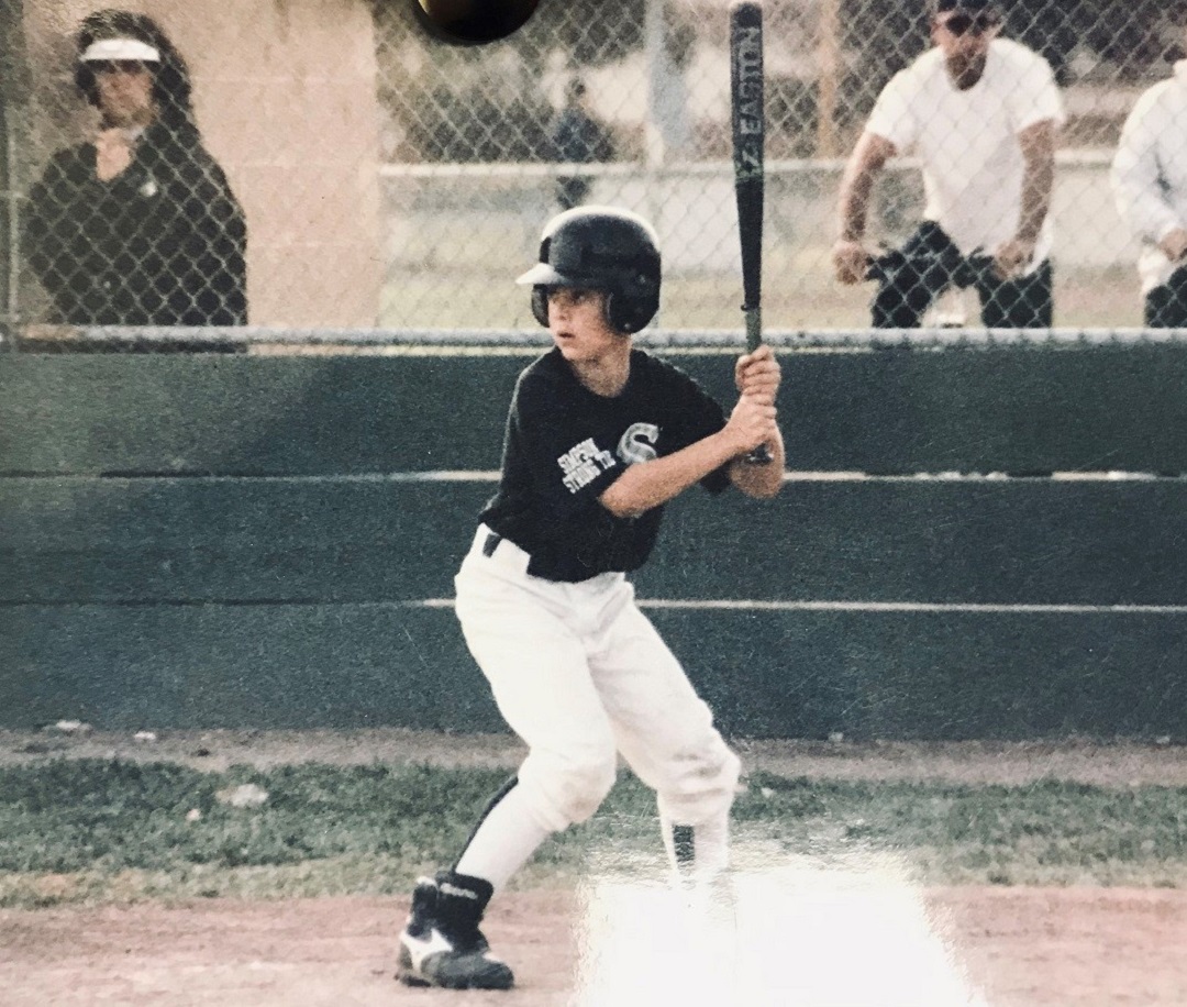 Sam Marcoux playing baseball as a boy
