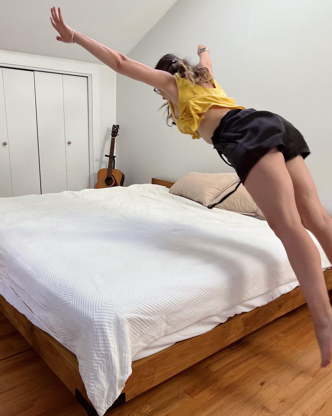 Joana Bianchi jumping on the bed