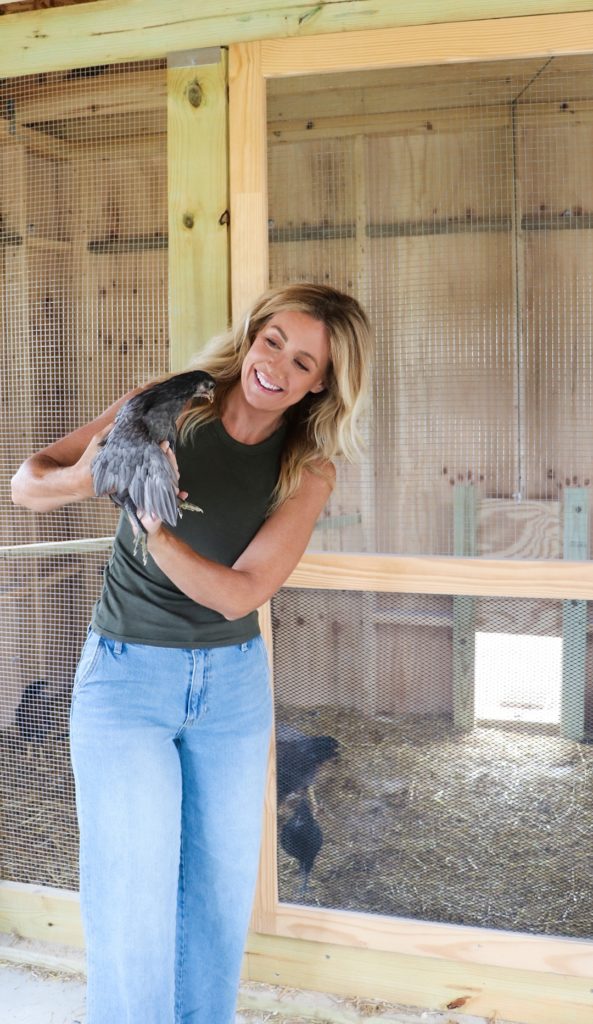 Dena with a chicken