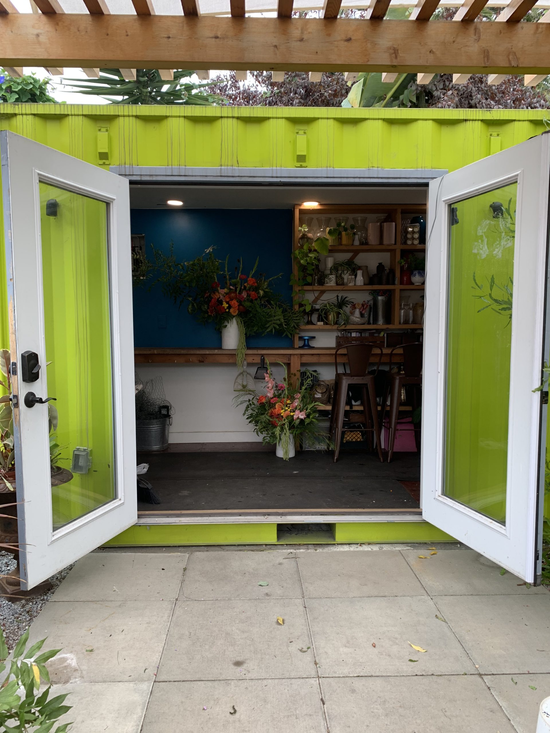 French doors opening into the flower shop
