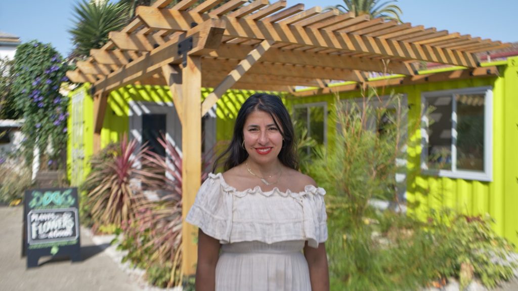 Owner Pilar in front of her flower shop