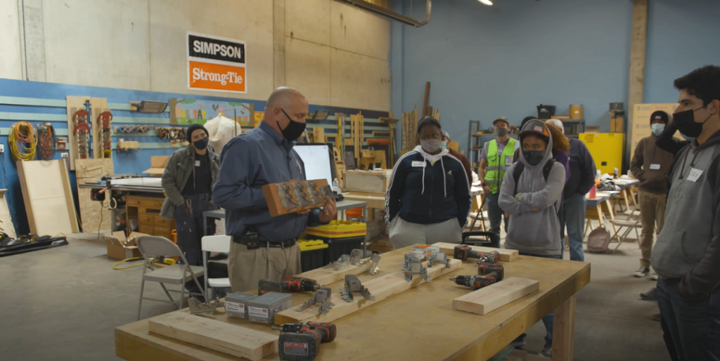 Simpson Strong-Tie employees teaching students about the trade