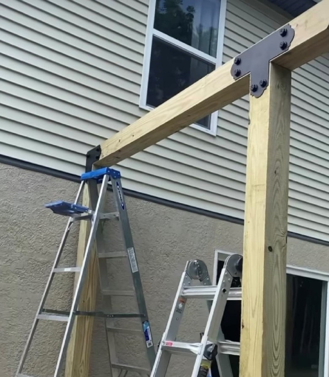 Simpson Strong-Tie Corner Strap and T-Strap attached to the pergola post