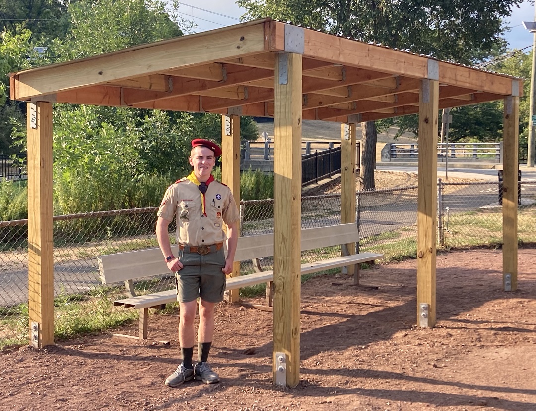 Boy Scout Max at the completed dugout built with Simpson Strong-Tie hardware