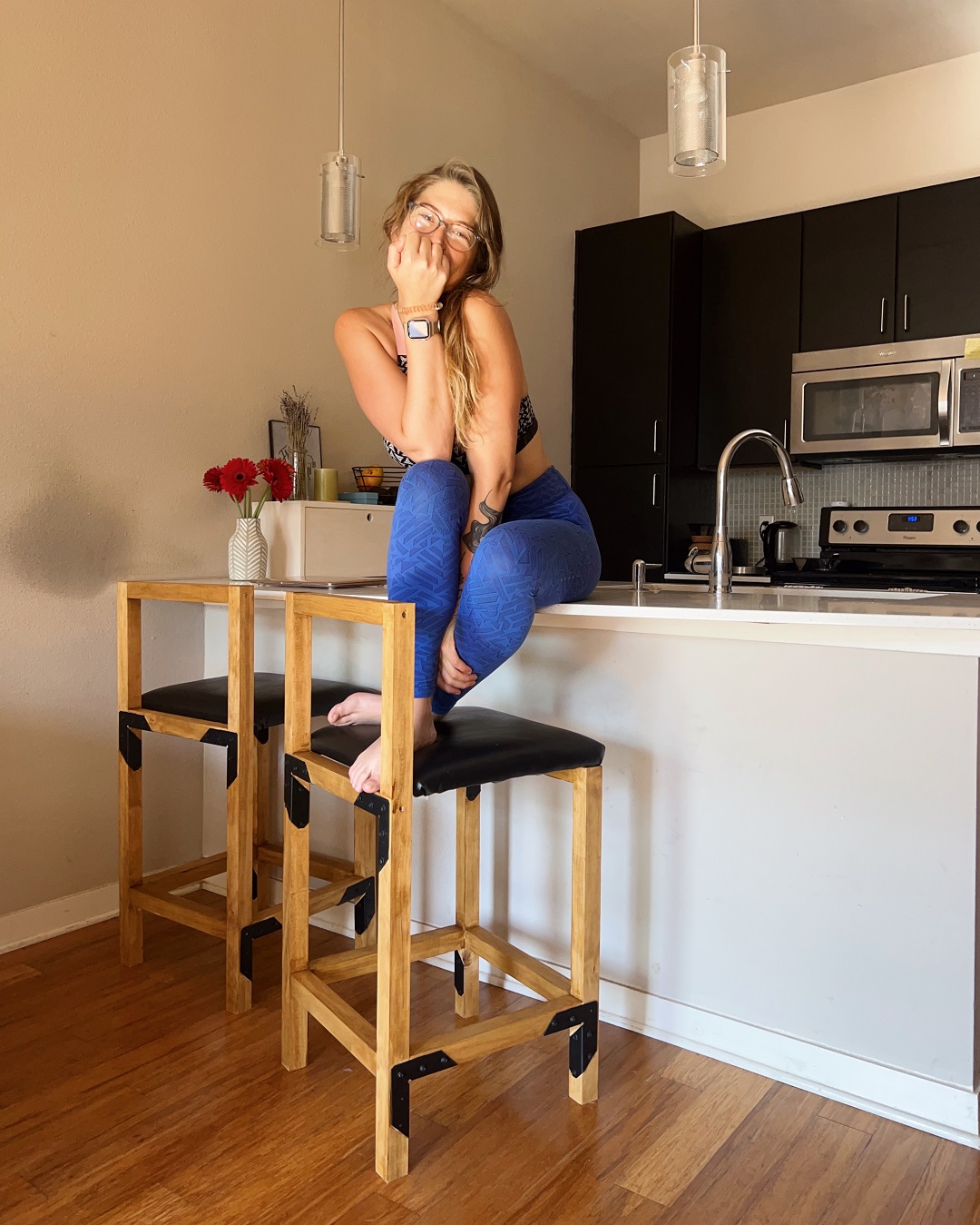 Joana Bianchi with her DIY countertop bar stools