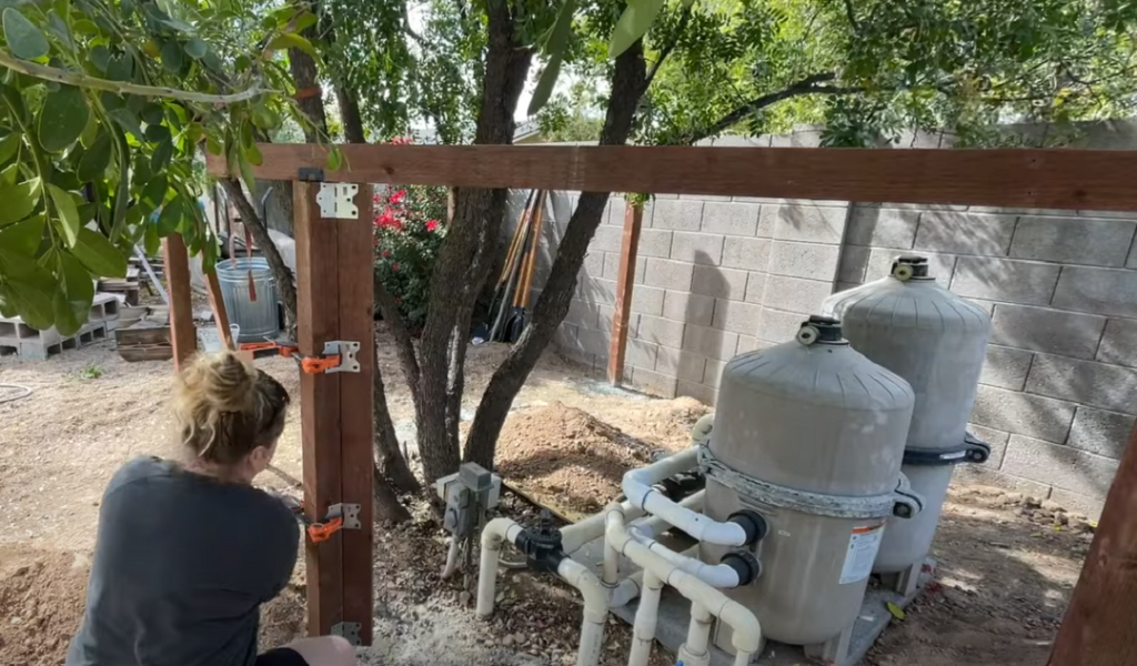 Sadie Mae John aka The Awesome Orange connecting an angled section of fence using Simpson Strong-Tie® LS30 skewable angle connectors