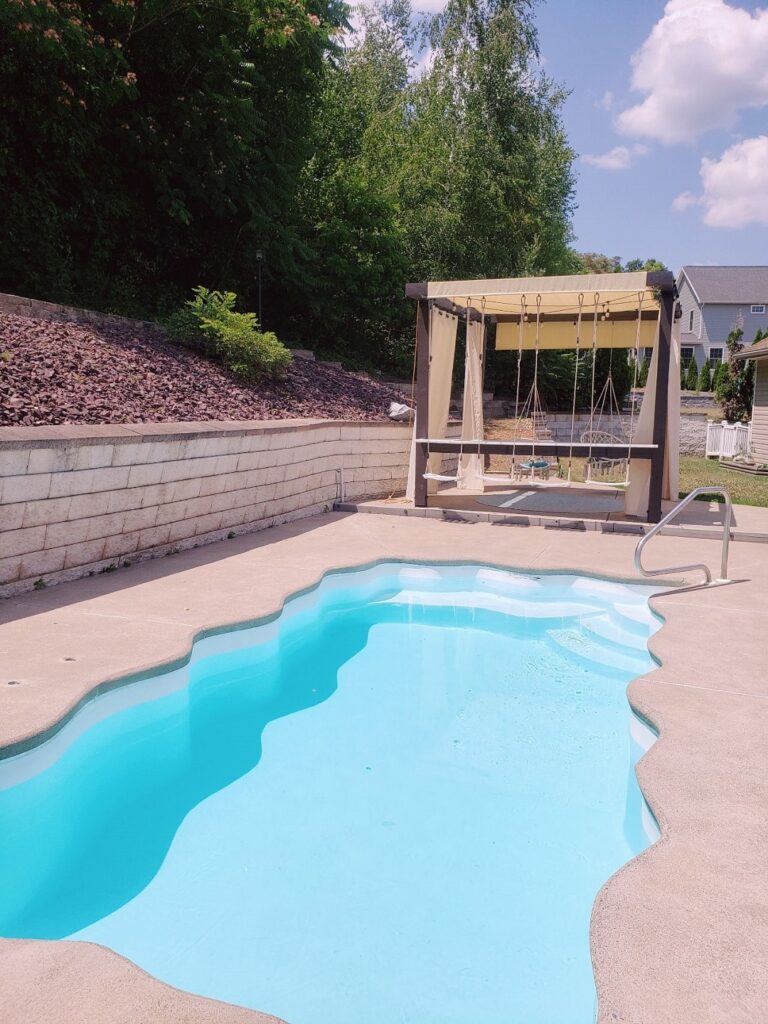 View of the DIY cantilever swing bar by the pool