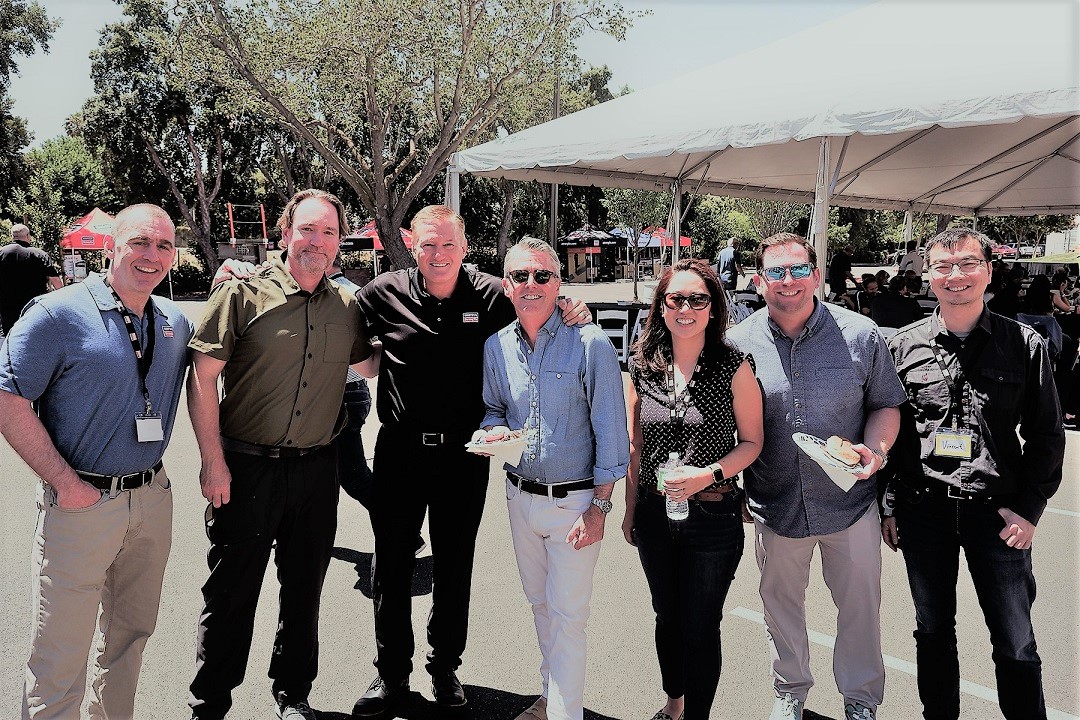 Mike Olosky and Simpson Strong-Tie Pleasanton employees enjoying a summer BBQ cookout