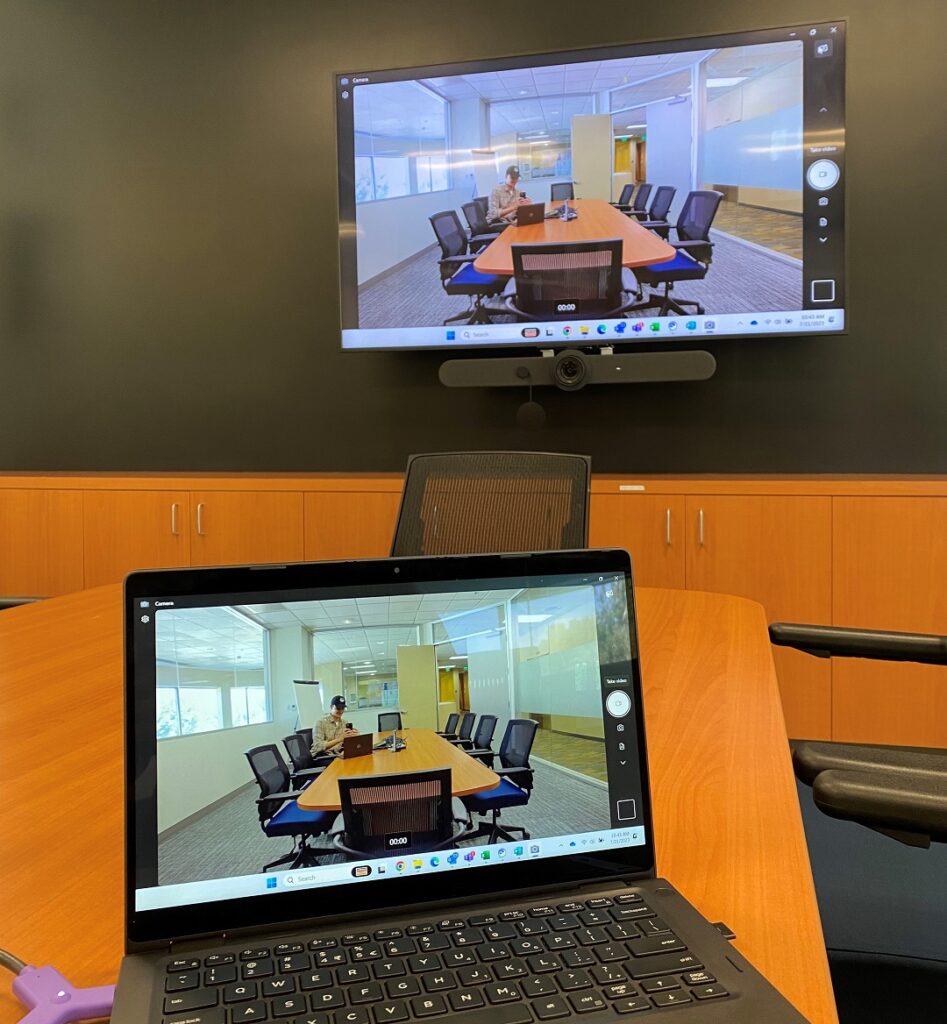 Luca working in a conference room