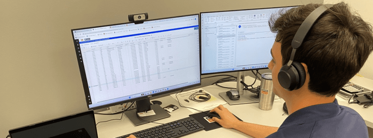 Luca working at the IT desk