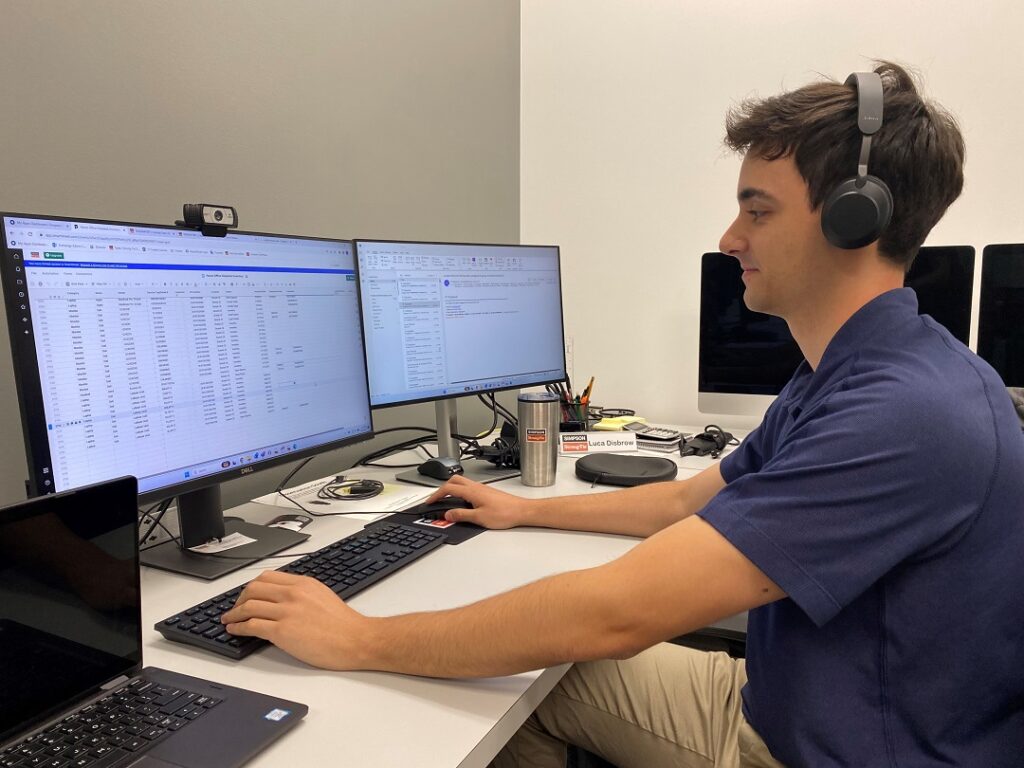 Luca working at the IT desk