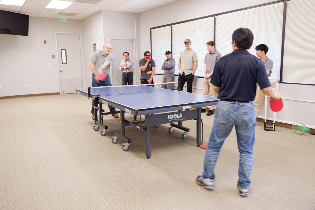 Enjoying a fun game of ping pong with IT folks