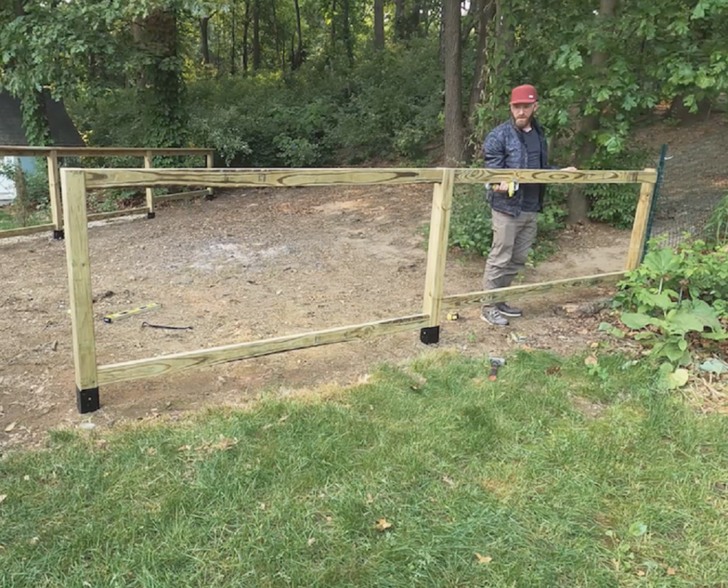 Adding the top railing to the garden fence