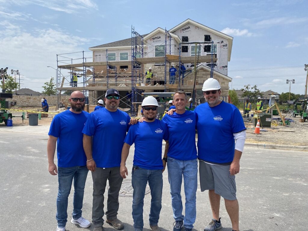 Group photo of Simpson Strong-Tie volunteers on the Extreme Makeover Home Edition jobsite