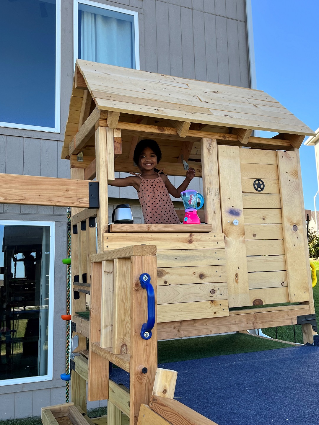 Nehal's daughter enjoying the completed playhouse