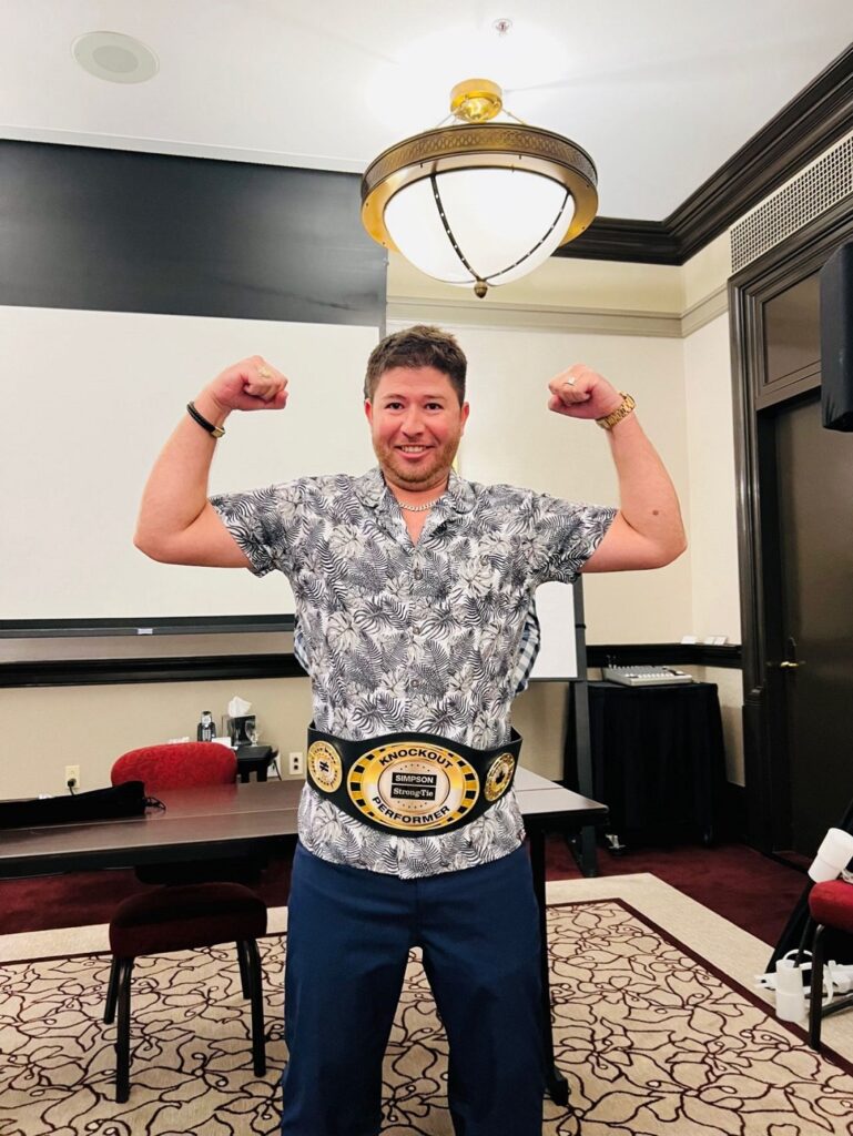 Johan wearing his Top Gun Award Championship Belt