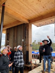 Employees observing inside the structure