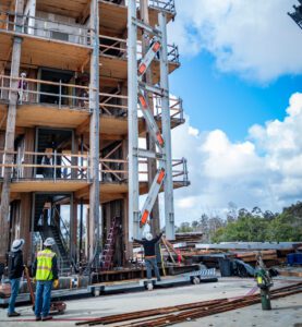 Engineers and construction workers on the site of the Converging Design project