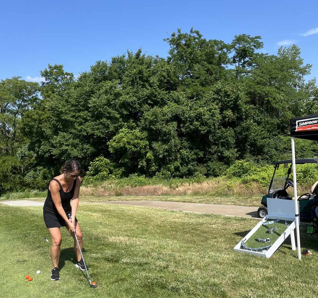 Playing a custom Simpson skee-ball chipping game made by Nehal and Thomas