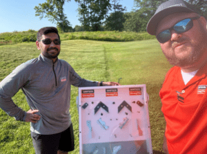 Nehal and Thomas with their DIY plinko game