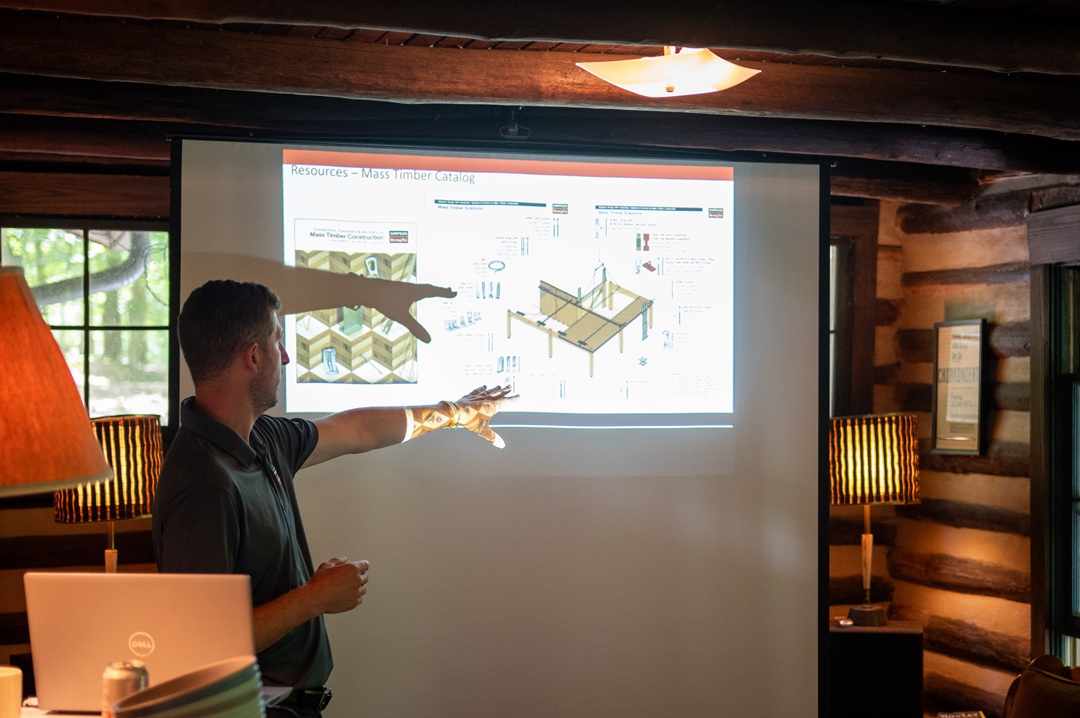 Daniel Hesington speaks to students at StickBuilt ‘25, sharing insights on sustainable wood design. © C.W. Newell Photography