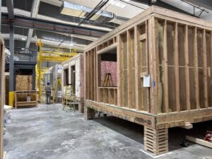 There are panels and modules at all different stages of construction in the facility. 